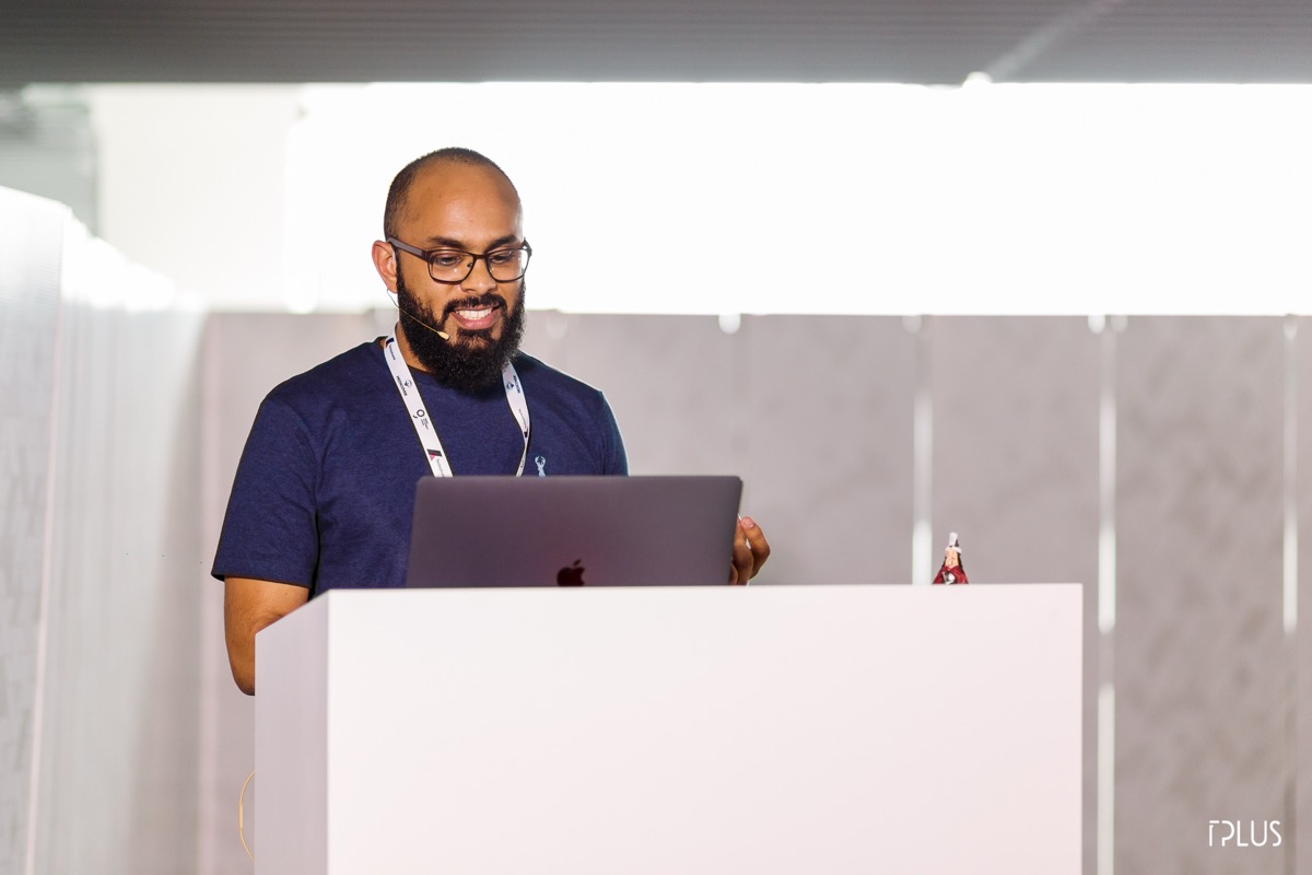 Omar Farook presenting on stage